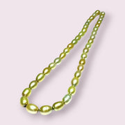Smooth Oval 7 x 8.5mm Champagne Green Cultured FW Pearl 16" Strand