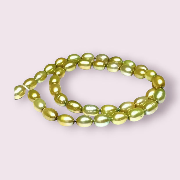 Smooth Oval 7 x 8.5mm Champagne Green Cultured FW Pearl 16" Strand