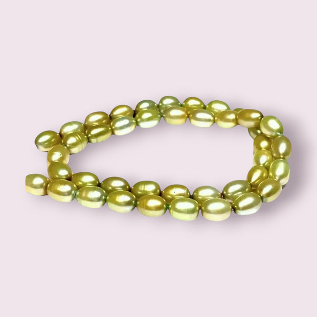 Smooth Oval 7 x 8.5mm Champagne Green Cultured FW Pearl 16" Strand
